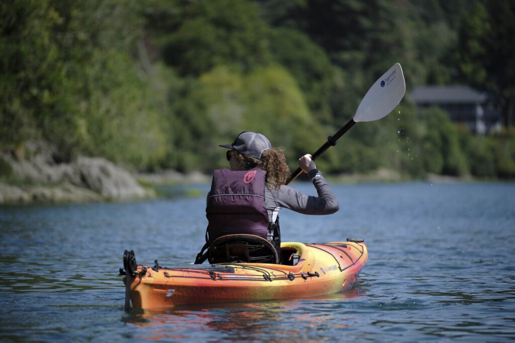 kayaker paddling on the Chetco River